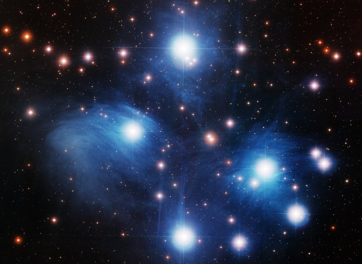 WIYN telescope image of the Pleiades; blue dust is photographic detail.