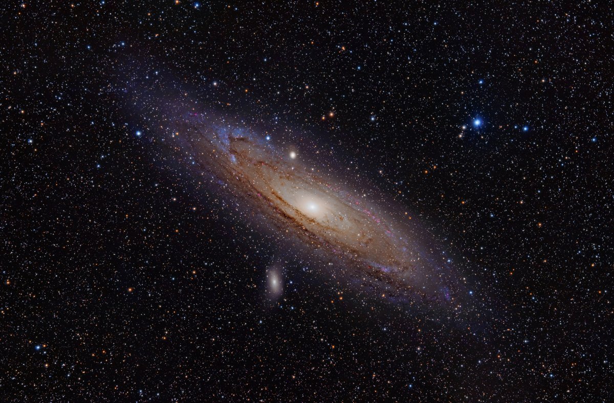 Processed Andromeda photograph includes detail binoculars cannot show.