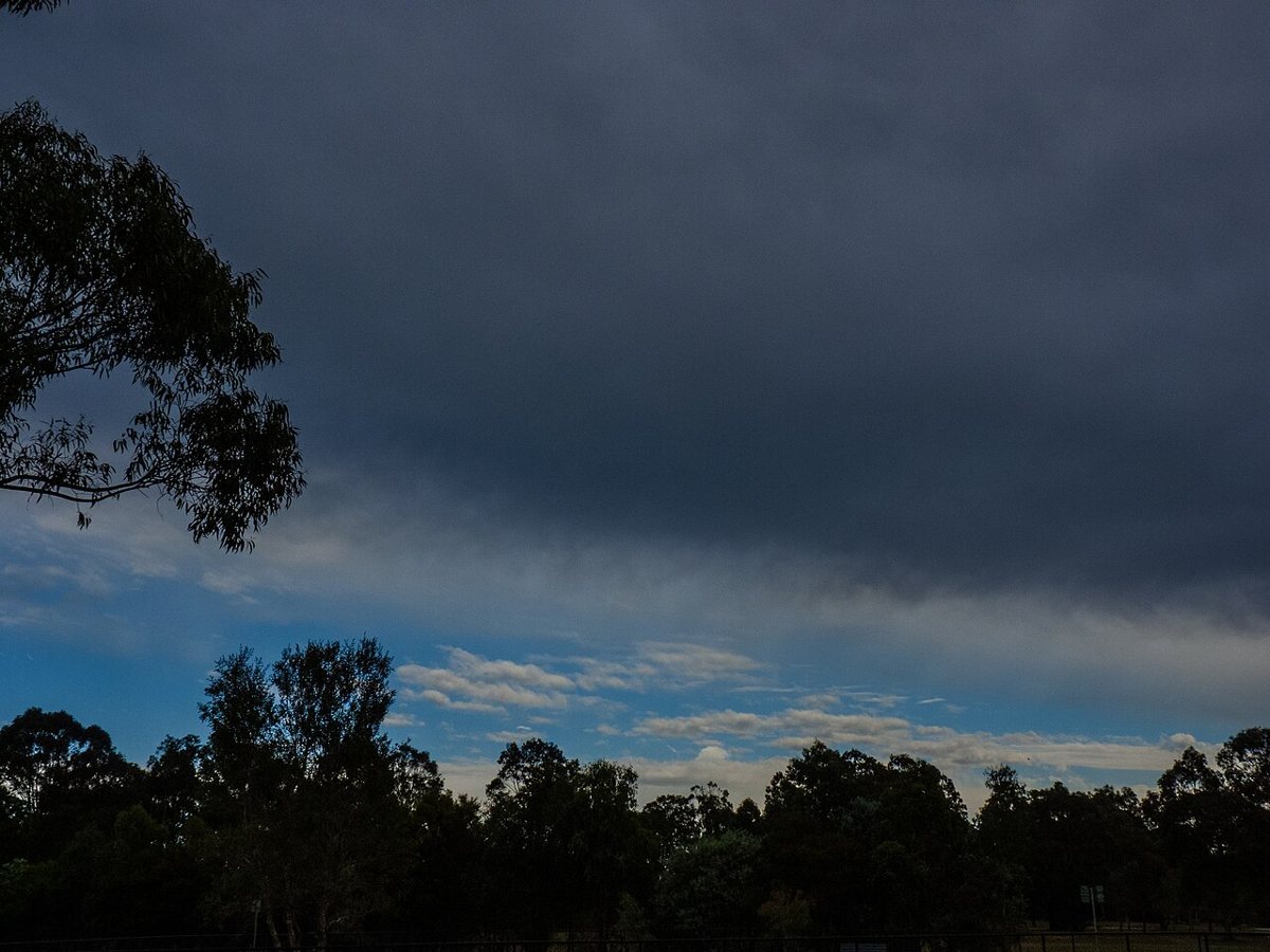 A stratus layer clearing near the horizon · John Robert McPherson · CC BY-SA 4.0