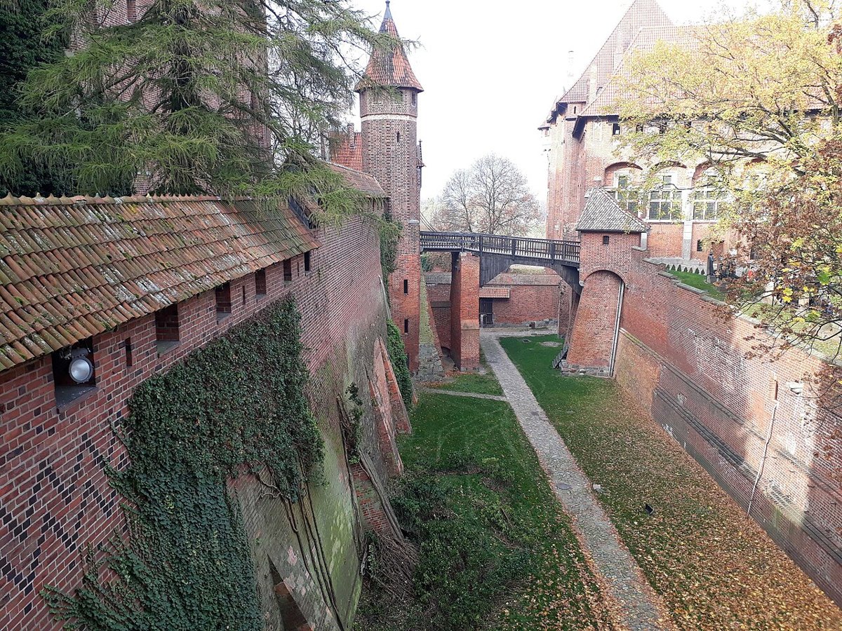 Malbork’s brick walls and layered castle complex.
