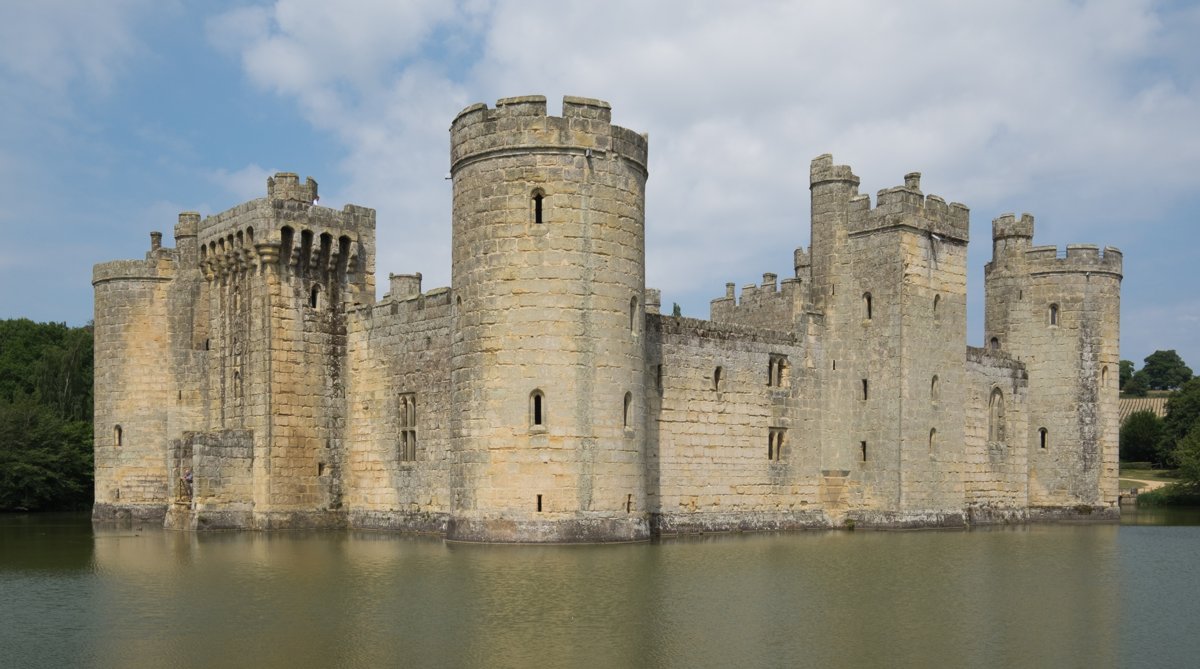 Bodiam’s walls reflected in its moat.