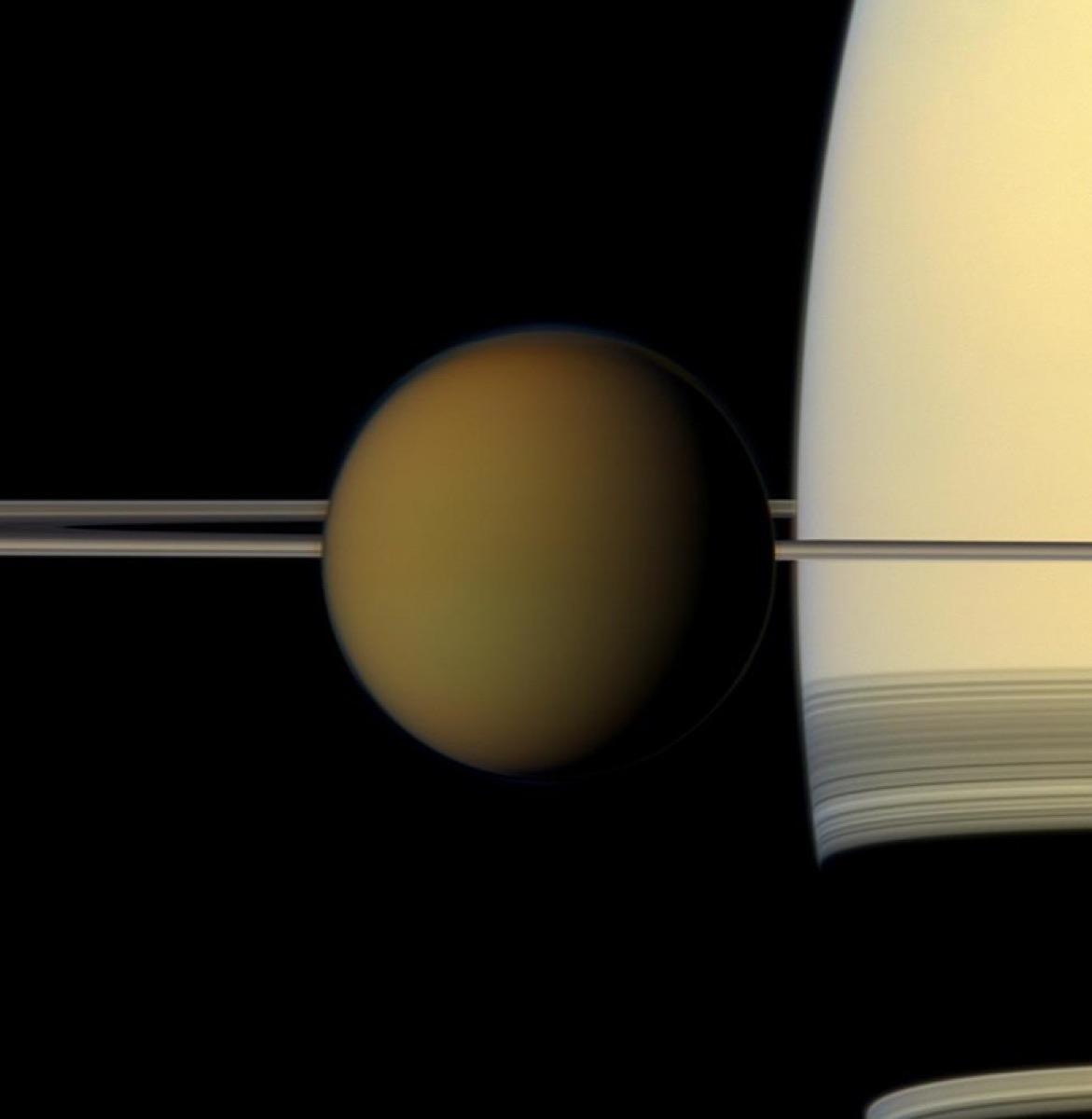 Titan in front of Saturn and its rings, photographed by Cassini. NASA/JPL-Caltech/Space Science Institute.